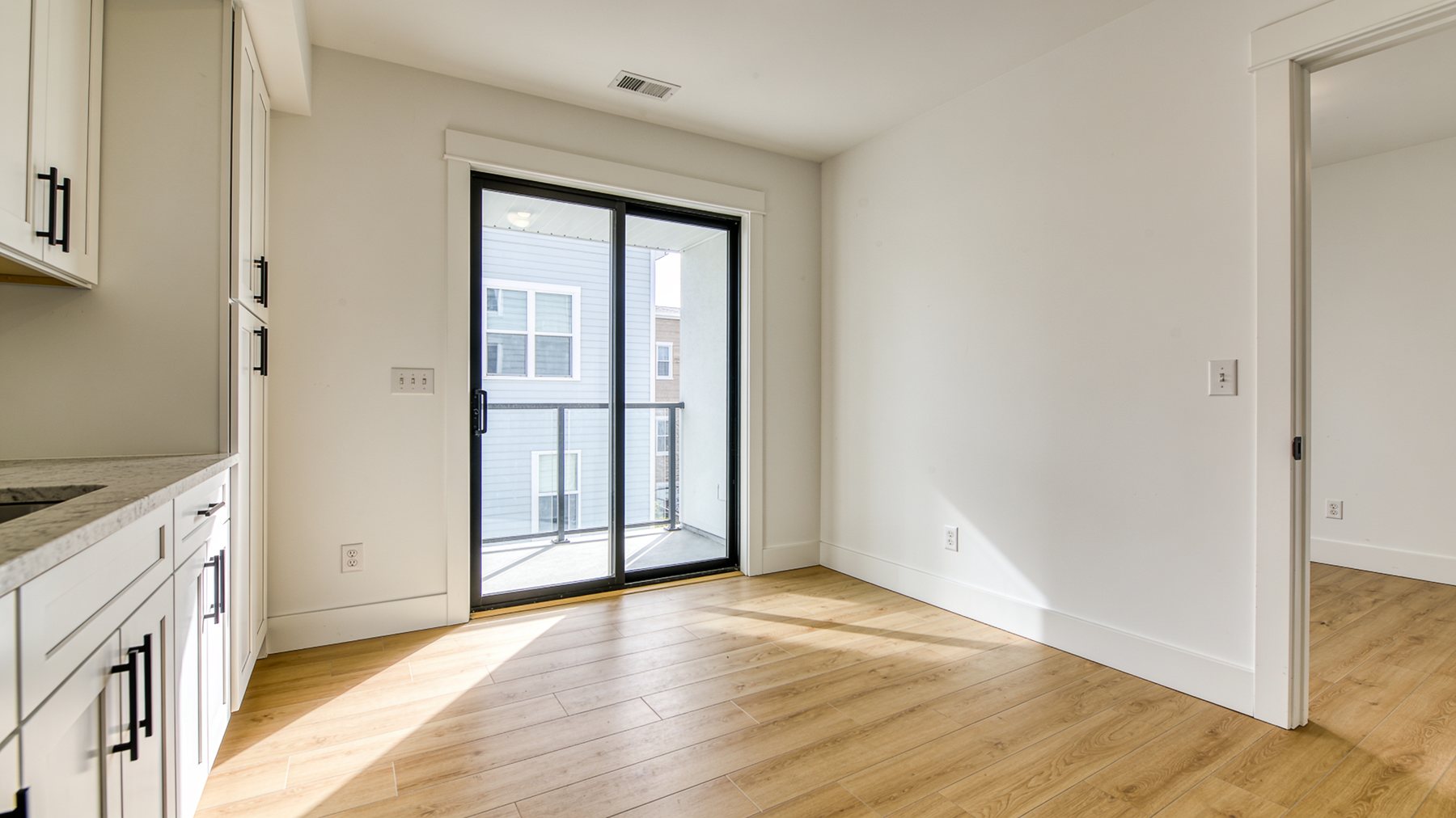 Freshly turned rental unit, empty and rent-ready with new flooring and fresh paint